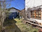 Garage - Charmante Doppelhaushälfte mit zwei Wohneinheiten, ausbaufähigem Dachgeschoss und Naturgarten
