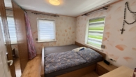 Schlafzimmer - Vermietetes Einfamilienhaus – 3,8 % Bruttorendite und Potenzial für einen weiteren Bauplatz
